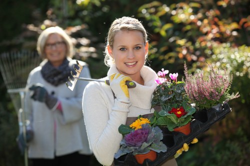 Professional gardener maintaining a lush outdoor space